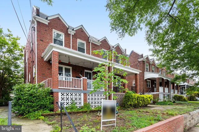 a front view of a building with garden