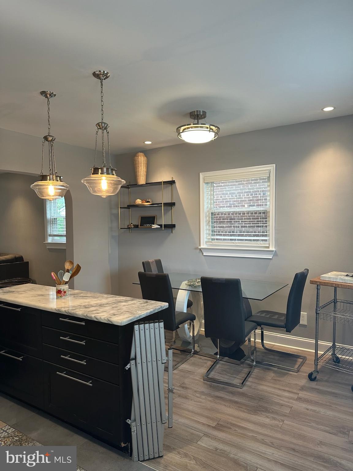 4627 12th Street Northeast Washington, DC 20017 - Photo 15 of 56 a room with a chandelier furniture and a wooden floor
