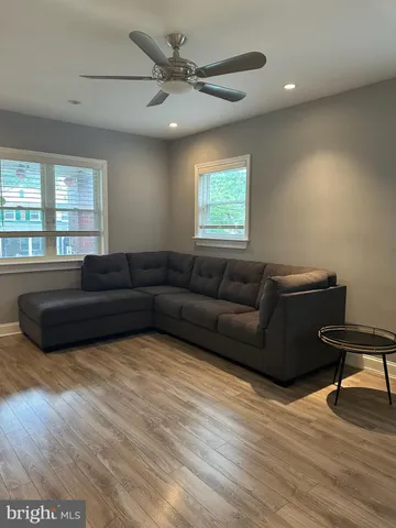 a bedroom with a bed next to a window