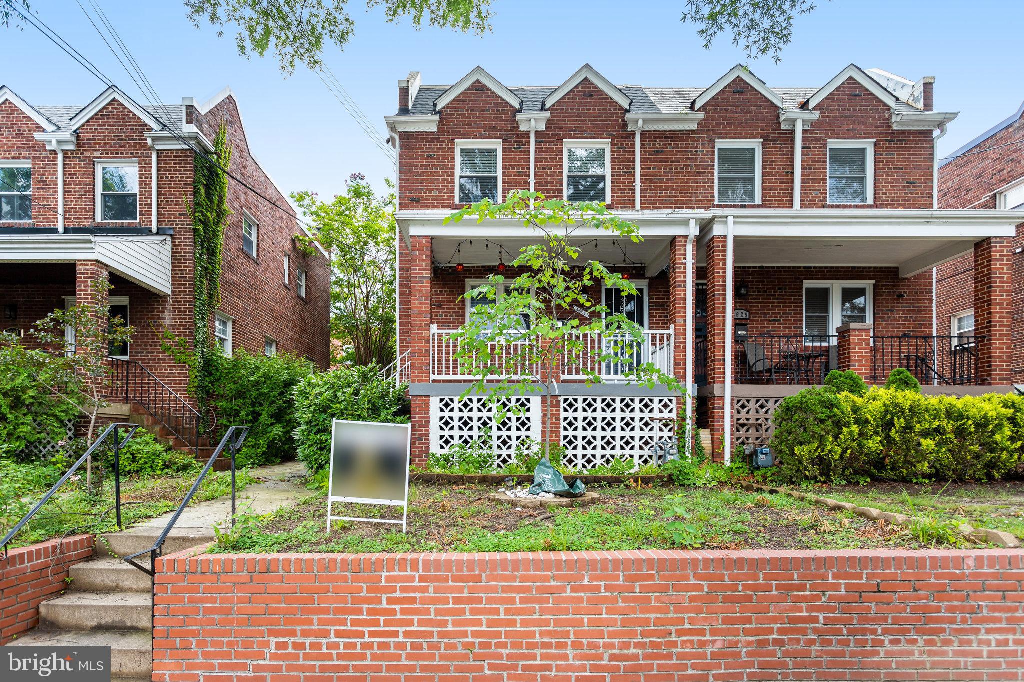4627 12th Street Northeast Washington, DC 20017 - Photo 3 of 56 a front view of a house with a garden