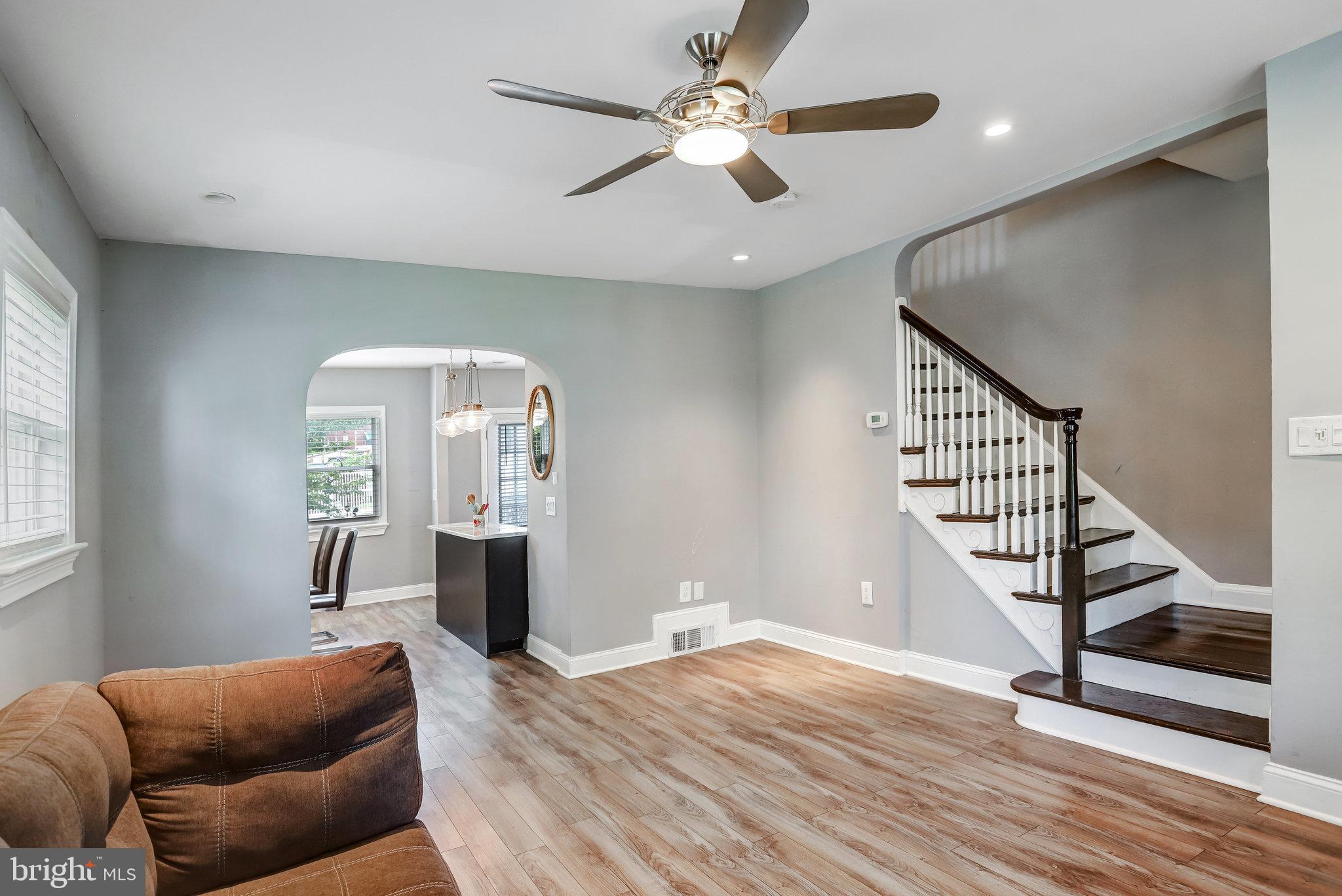 4627 12th Street Northeast Washington, DC 20017 - Photo 38 of 56 a living room with furniture and a wooden floor