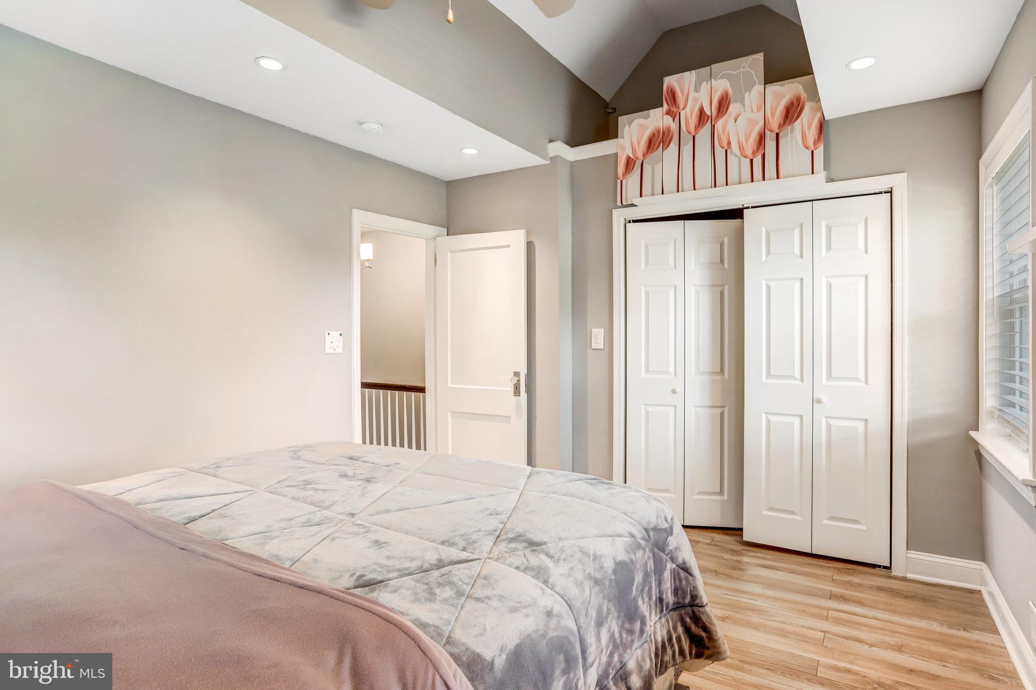 4627 12th Street Northeast Washington, DC 20017 - Photo 41 of 56 a bedroom with a bed and a painting on the wall