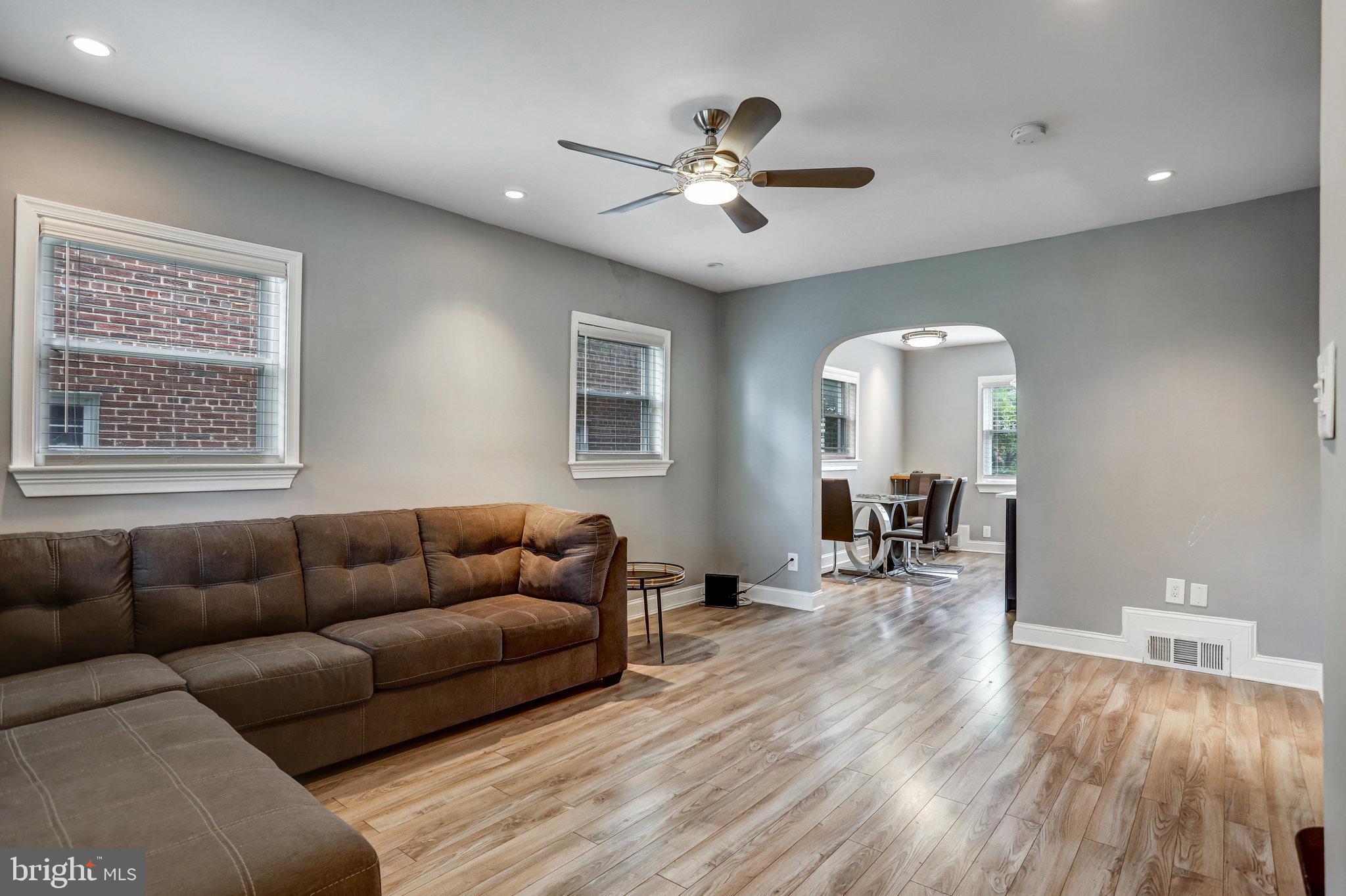4627 12th Street Northeast Washington, DC 20017 - Photo 43 of 56 a living room with furniture and wooden floor