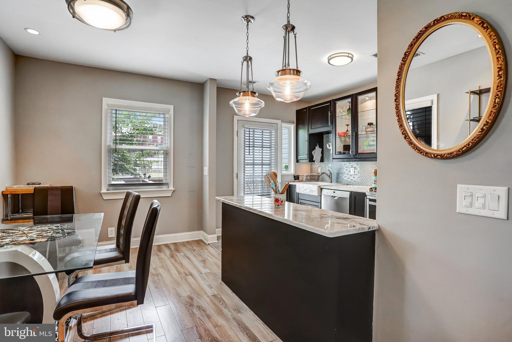 4627 12th Street Northeast Washington, DC 20017 - Photo 48 of 56 a very nice looking dining room with a large window and chandelier