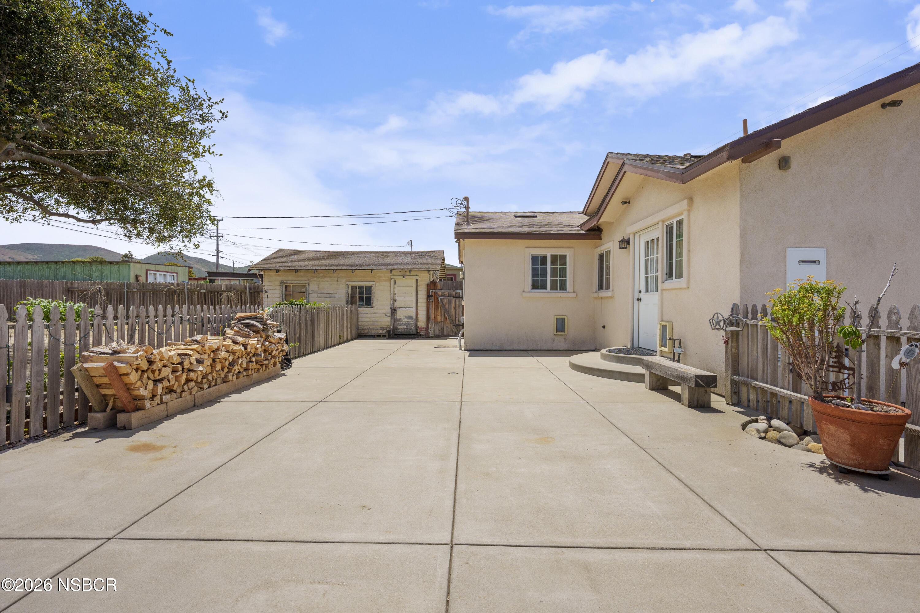 138 North E Street Lompoc, CA 93436 - Photo 28 of 35 a view of a house with backyard