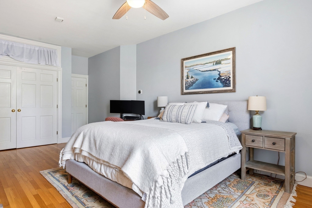 35 High Street, Unit 1 Boston, MA 02129 - Photo 7 of 33 a bedroom with a bed and wooden floor