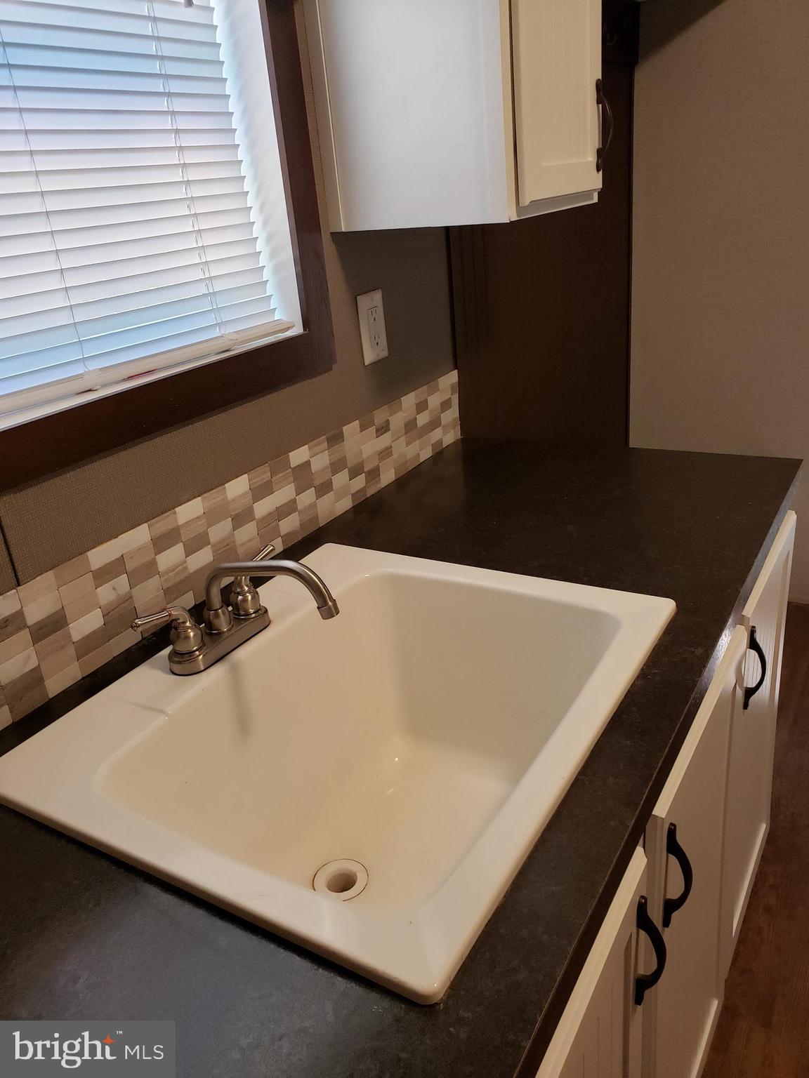 357 Packing House Road Berkeley Springs, WV 25411 - Photo 33 of 42 Sink in Laundry area