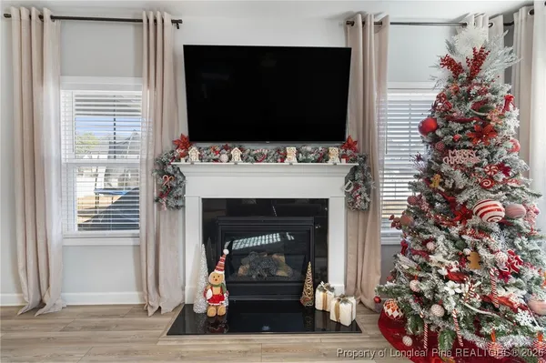 a kitchen with stainless steel appliances granite countertop grey cabinets sink and stove