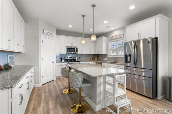 a en suite bathroom with a sink and a mirror