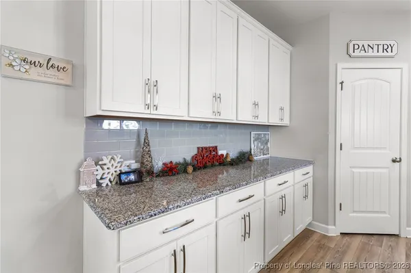 a bathroom with a sink vanity and a mirror