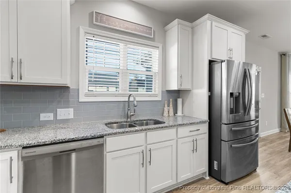 a bedroom with a bed and a chair