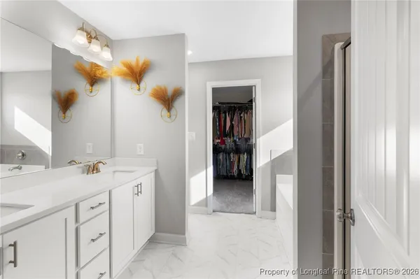 a bedroom with a flat screen tv and a bed