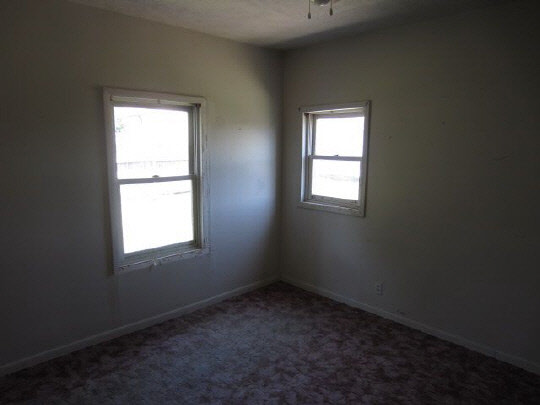 315 8th Street Rochelle, IL 61068 - Photo 5 of 11 an empty room with a window