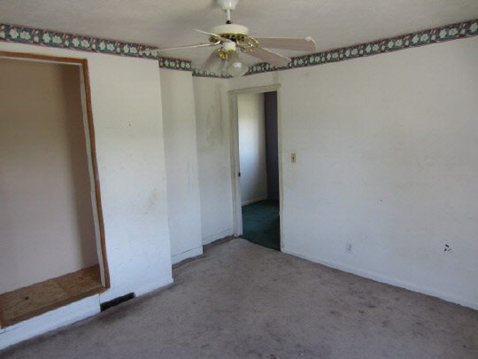 315 8th Street Rochelle, IL 61068 - Photo 8 of 11 a view of a hallway with a chandelier