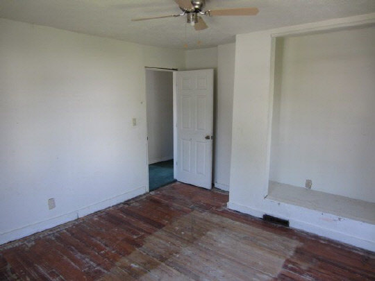 315 8th Street Rochelle, IL 61068 - Photo 9 of 11 a view of a room with wooden floor and a ceiling fan