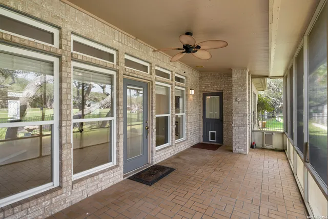 a view of a hallway with a glass door