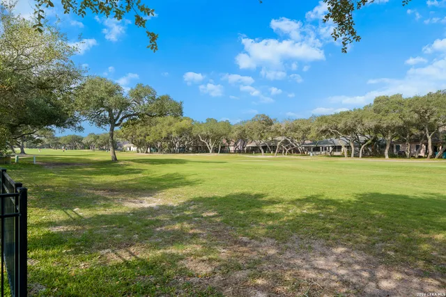 a view of a golf course with a garden