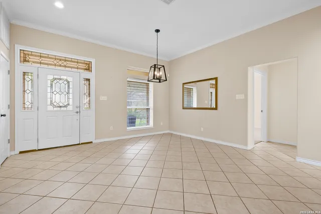 a view of an empty room with windows