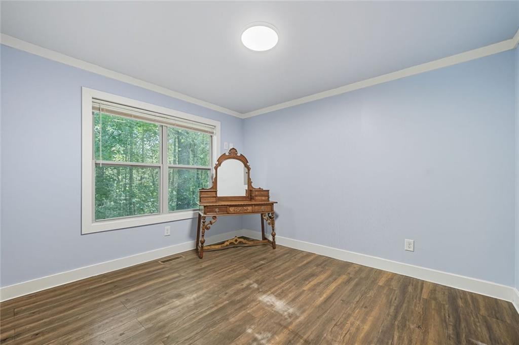 275 Old Whitestone Road West Talking Rock, GA 30175 - Photo 19 of 30 a view of a workspace with wooden floor and a window