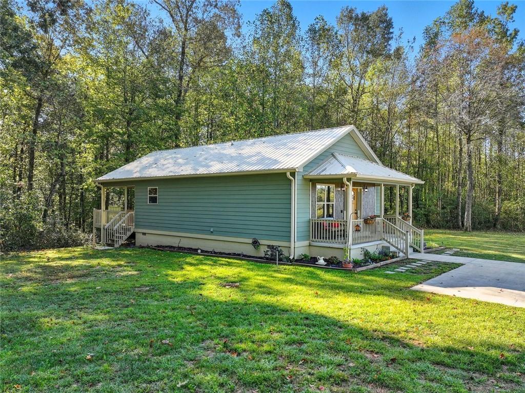 275 Old Whitestone Road West Talking Rock, GA 30175 - Photo 22 of 30 a view of a house with a yard