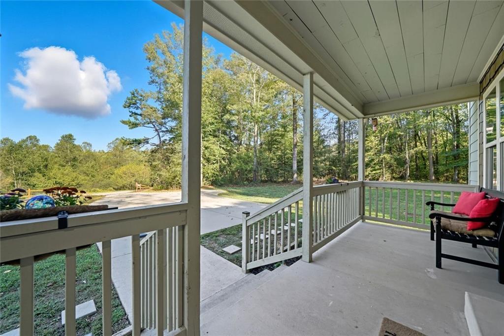 275 Old Whitestone Road West Talking Rock, GA 30175 - Photo 4 of 30 a view of a porch with furniture and wooden deck