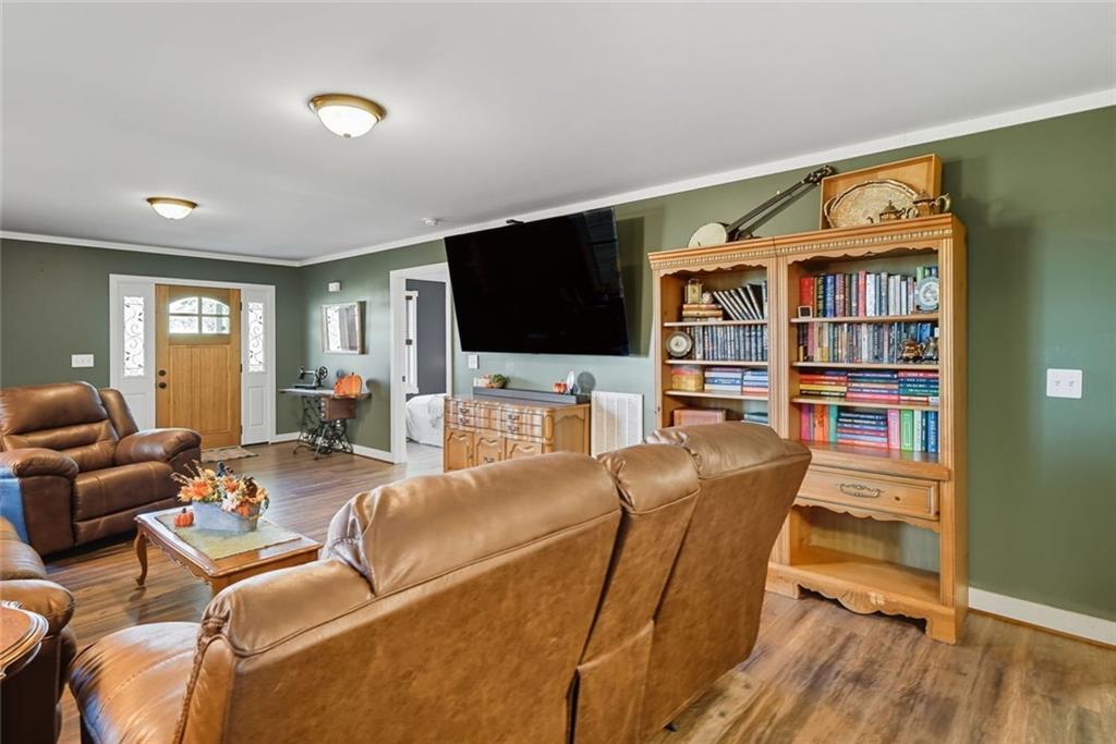 275 Old Whitestone Road West Talking Rock, GA 30175 - Photo 9 of 30 a living room with furniture and a flat screen tv