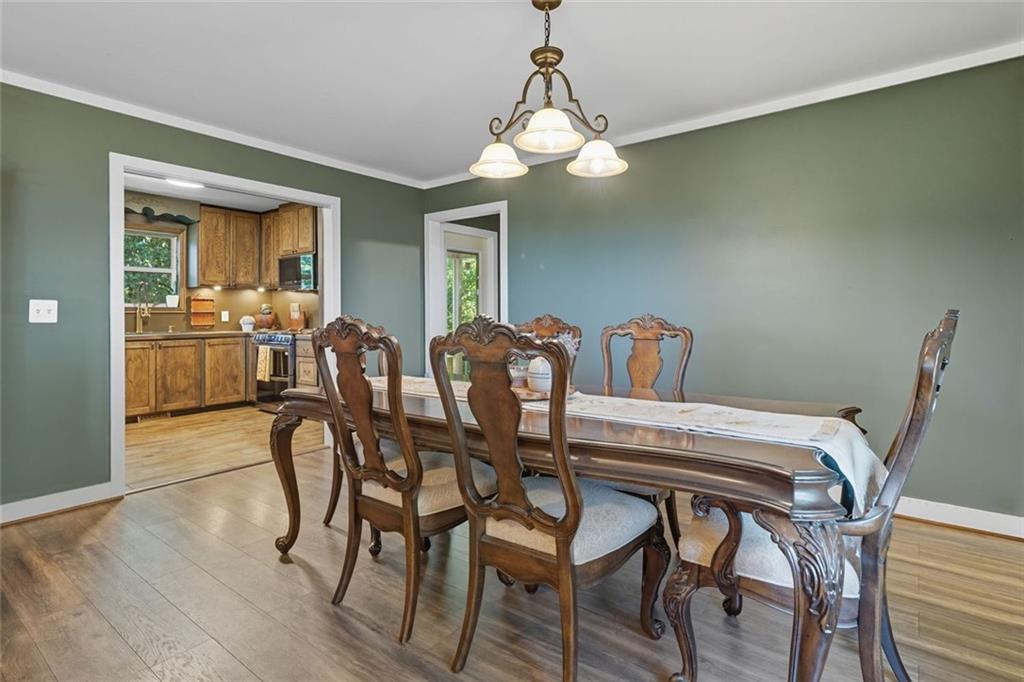 275 Old Whitestone Road West Talking Rock, GA 30175 - Photo 10 of 30 a view of a dining room with furniture and wooden floor