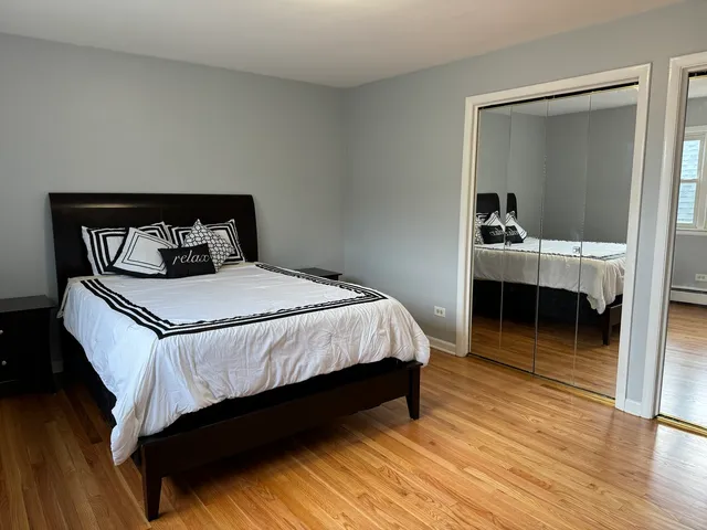 a bedroom with a bed and a table