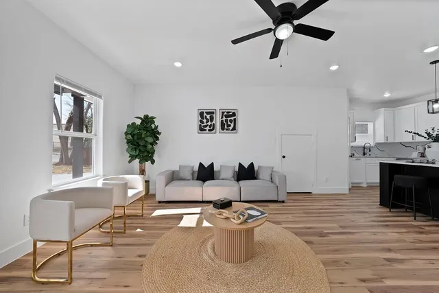 a living room with furniture and a fireplace