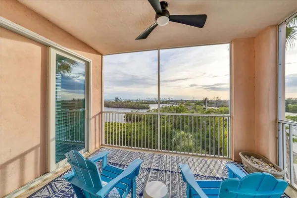 a view of a balcony next to a yard