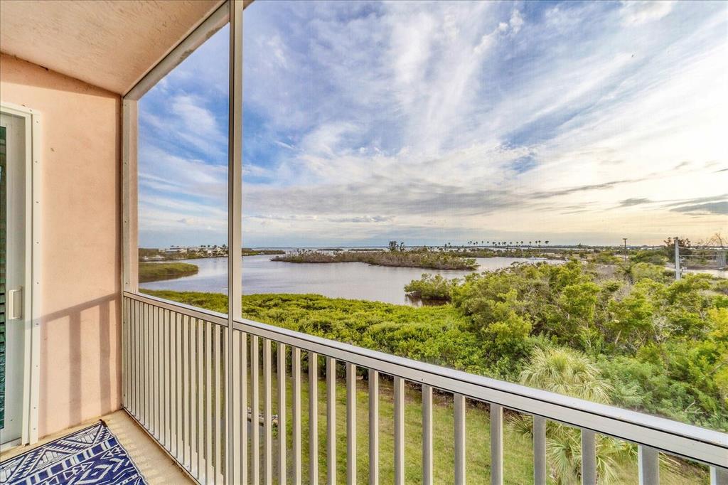 13113 Gasparilla Road, Unit 405 Placida, FL 33946 - Photo 19 of 23 a view of a balcony next to a yard