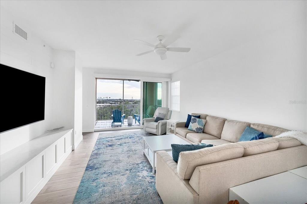 13113 Gasparilla Road, Unit 405 Placida, FL 33946 - Photo 9 of 23 a living room with furniture and a flat screen tv