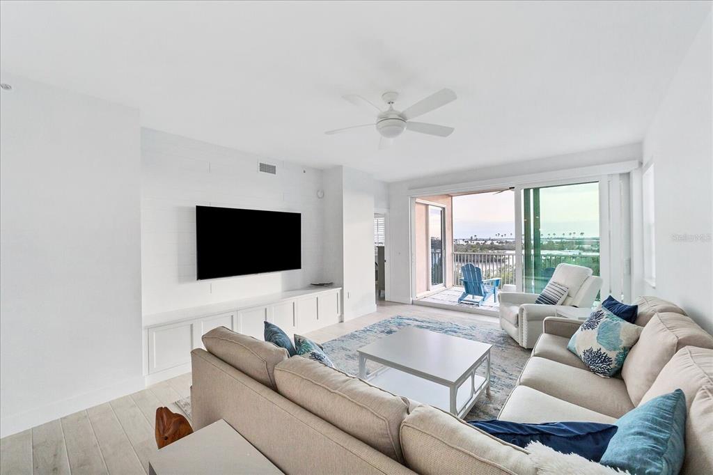 13113 Gasparilla Road, Unit 405 Placida, FL 33946 - Photo 10 of 23 a living room with furniture and a flat screen tv