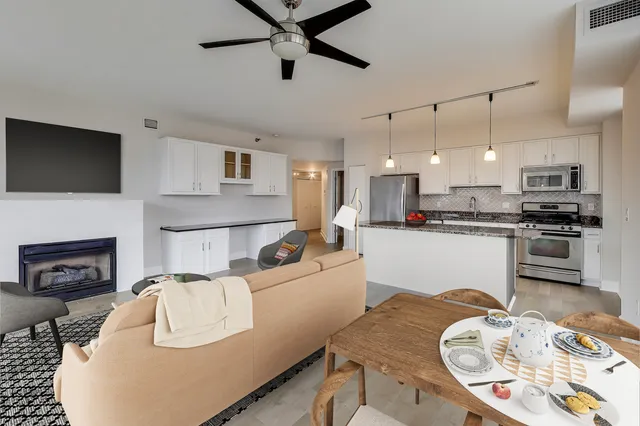 a kitchen with stainless steel appliances granite countertop a stove and a refrigerator