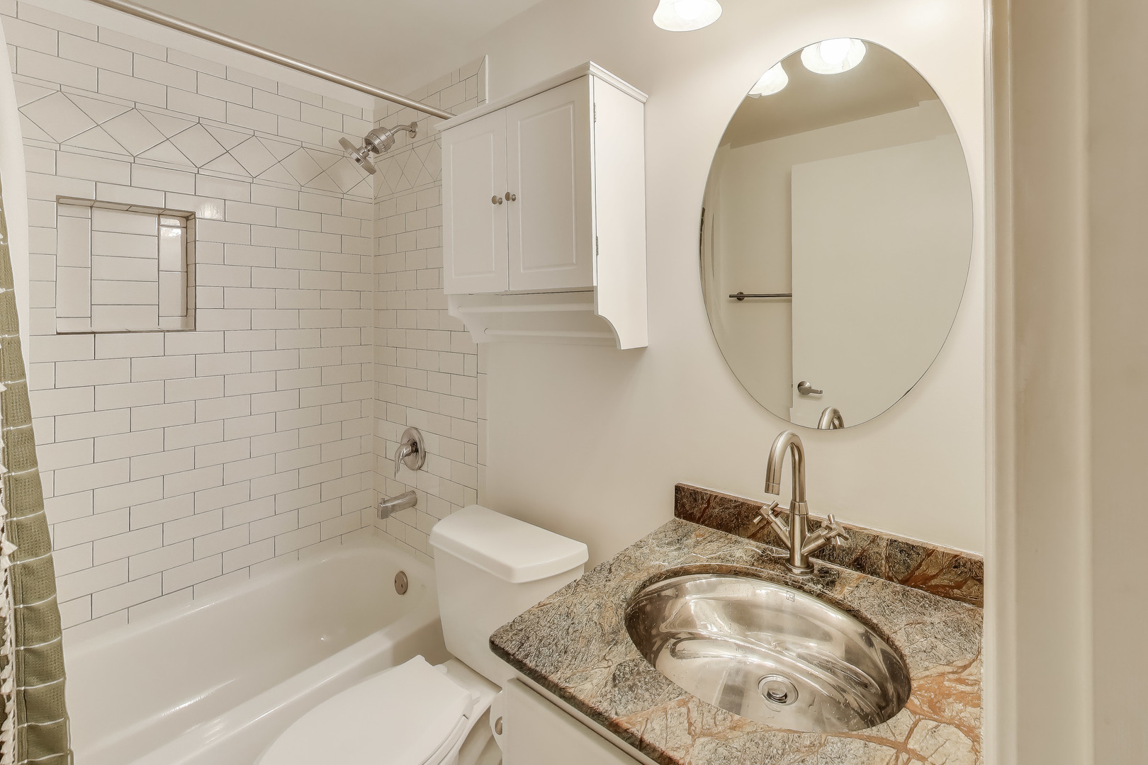 5 East 14th Place, Unit 501 Chicago, IL 60605 - Photo 28 of 37 a bathroom with a granite countertop sink and a mirror