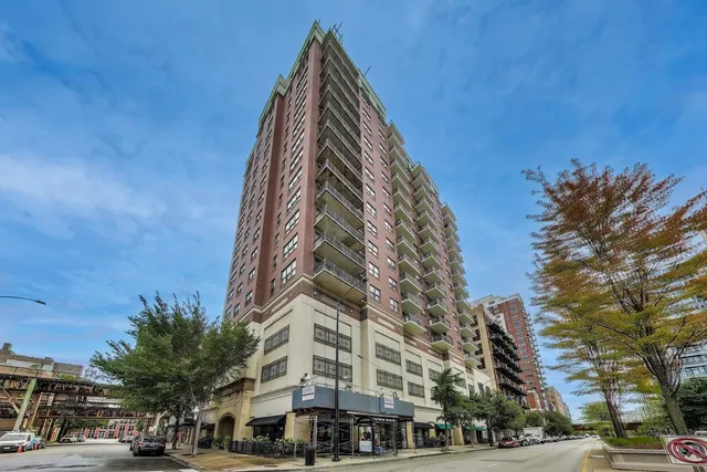 a view of a buildings with a yard