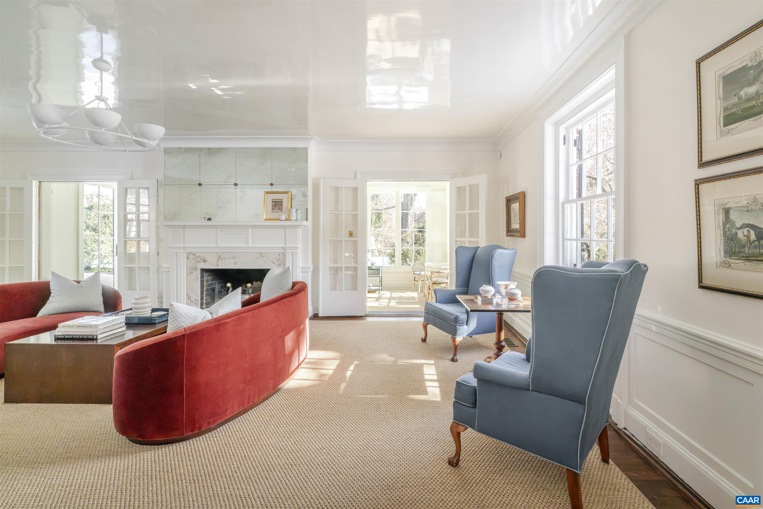 921 Rugby Road Charlottesville, VA 22903 - Photo 12 of 41 a living room with furniture a large window and a fireplace