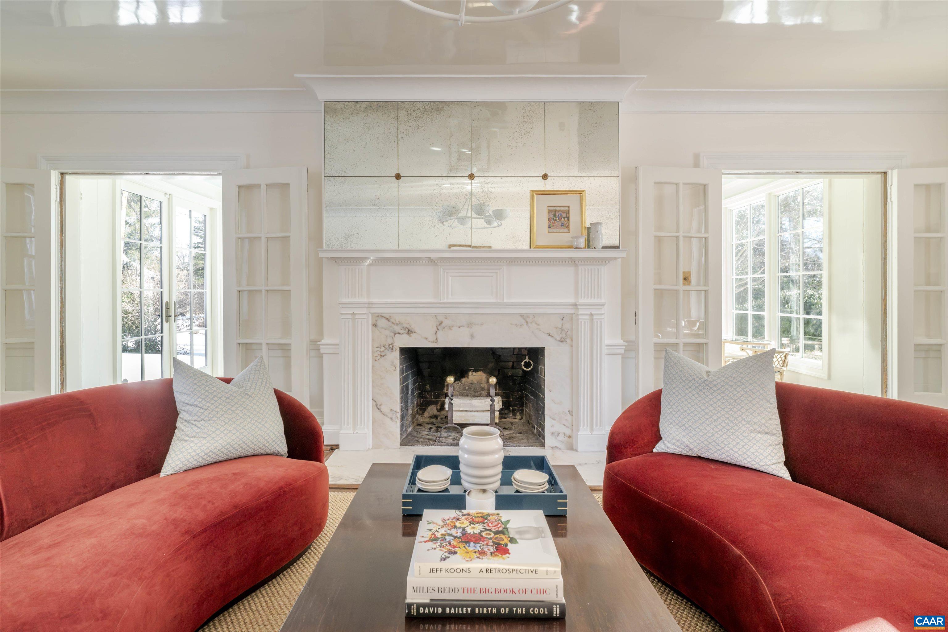 921 Rugby Road Charlottesville, VA 22903 - Photo 13 of 41 a living room with furniture and a fireplace