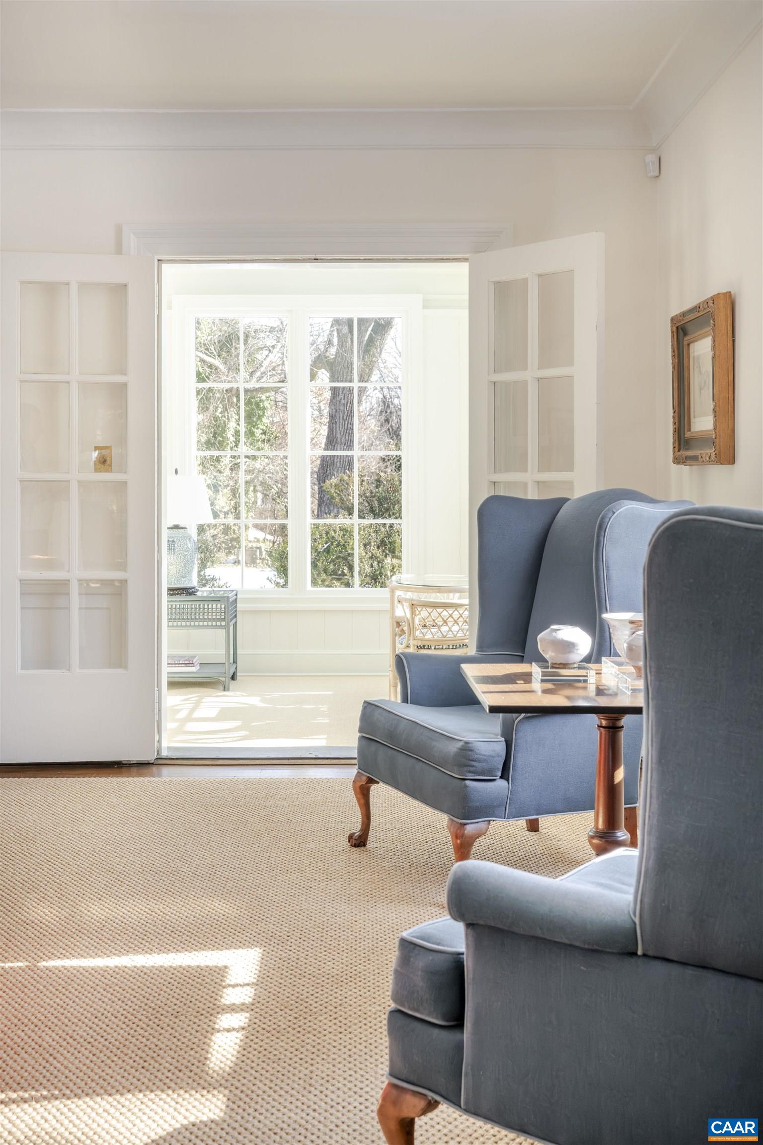 921 Rugby Road Charlottesville, VA 22903 - Photo 16 of 41 a living room with furniture and a large window