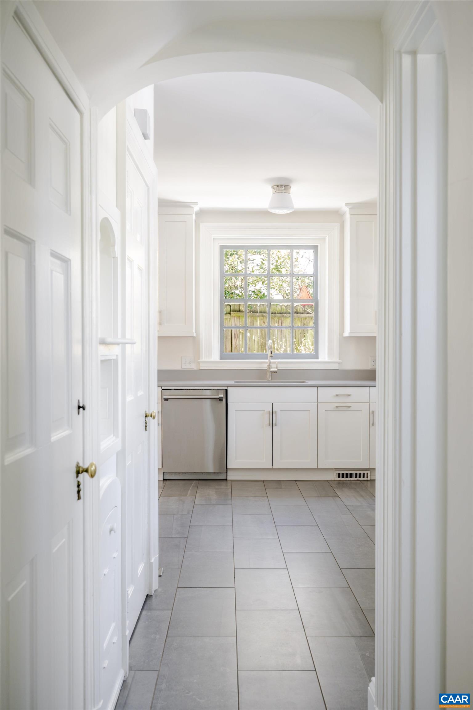 921 Rugby Road Charlottesville, VA 22903 - Photo 24 of 41 a bathroom with a bathtub sink and window