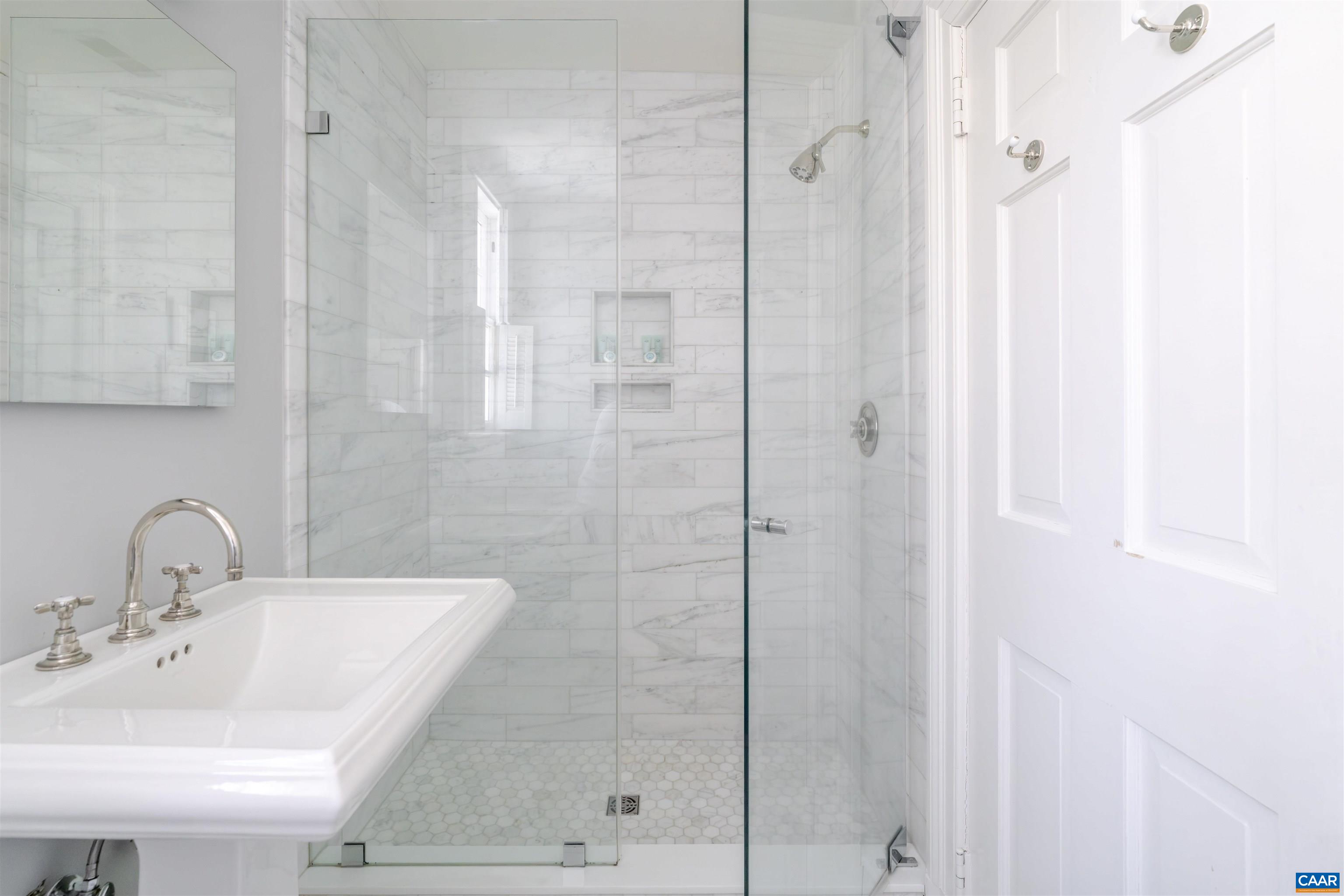 921 Rugby Road Charlottesville, VA 22903 - Photo 29 of 41 a bathroom with a sink and shower