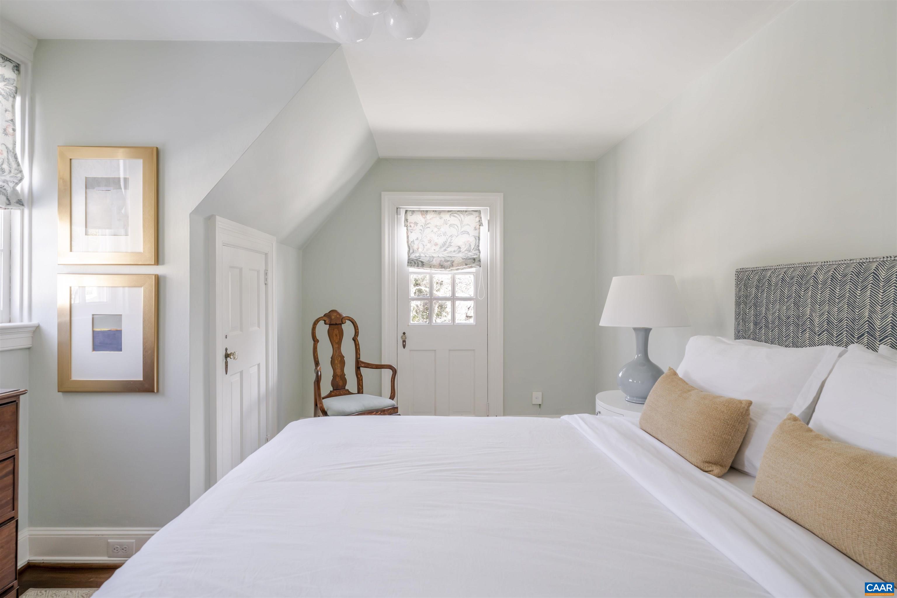 921 Rugby Road Charlottesville, VA 22903 - Photo 31 of 41 a bedroom with a bed and a window