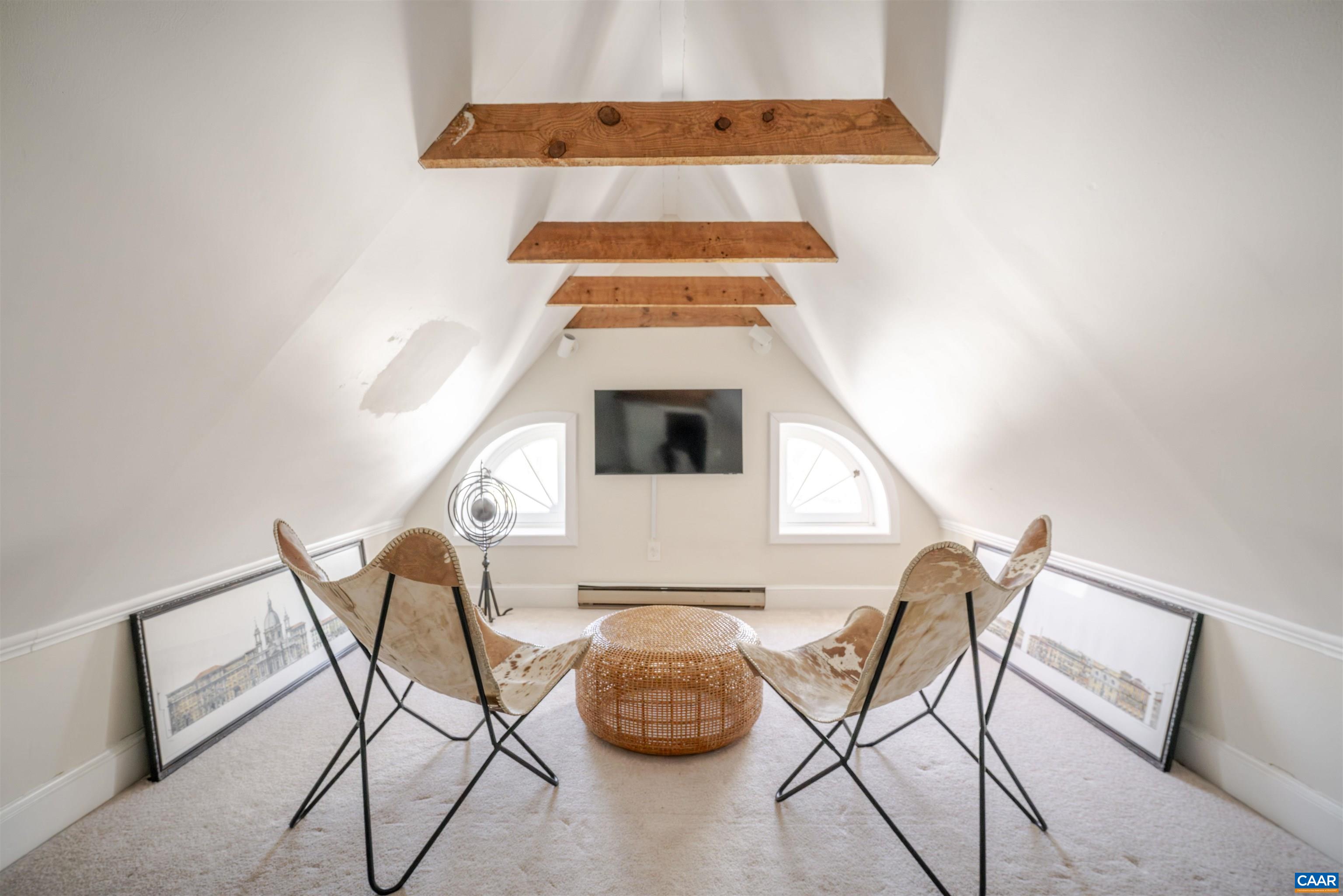 921 Rugby Road Charlottesville, VA 22903 - Photo 38 of 41 a living room with a couch and a table