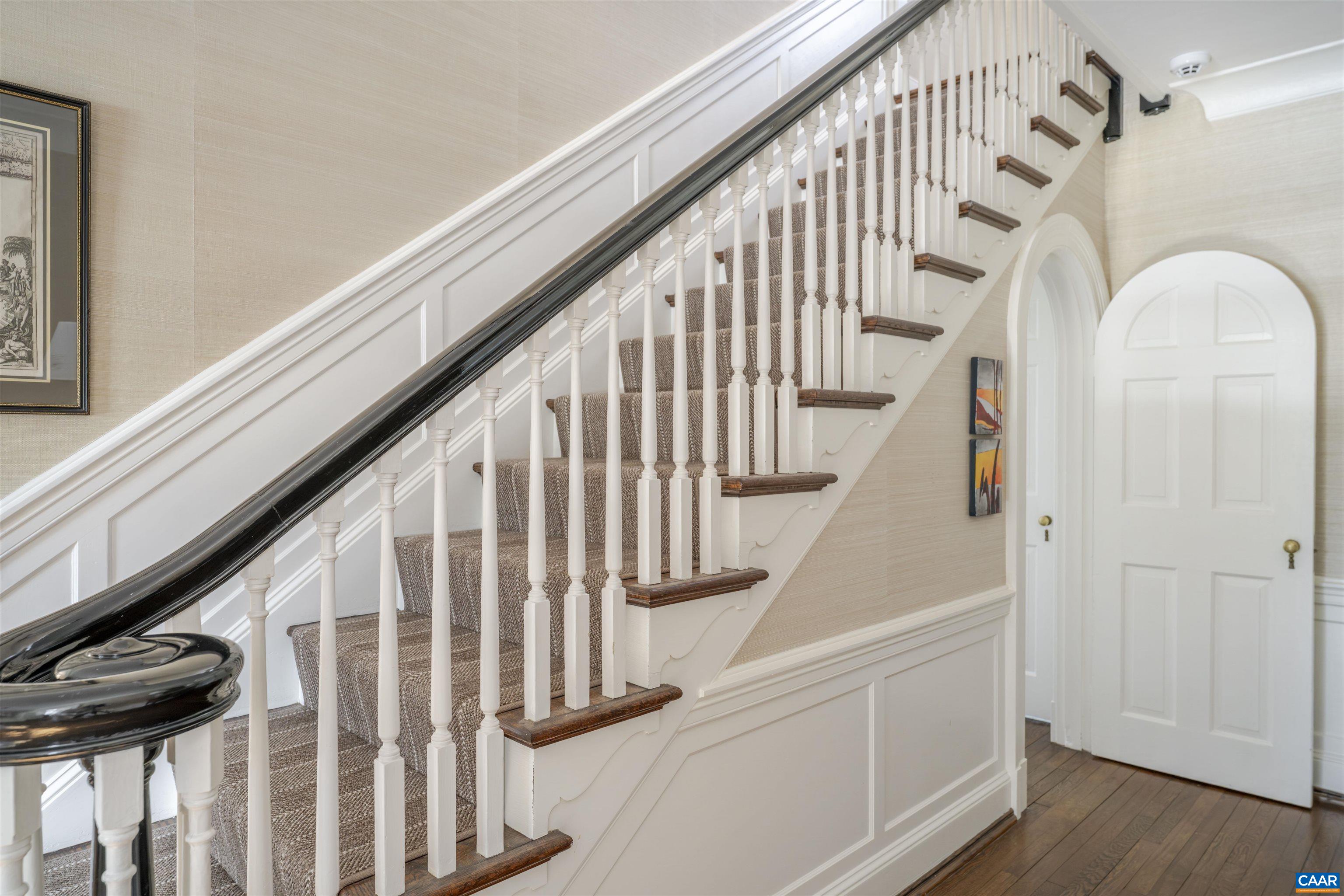921 Rugby Road Charlottesville, VA 22903 - Photo 4 of 41 a view of entryway with wooden floor and stairs