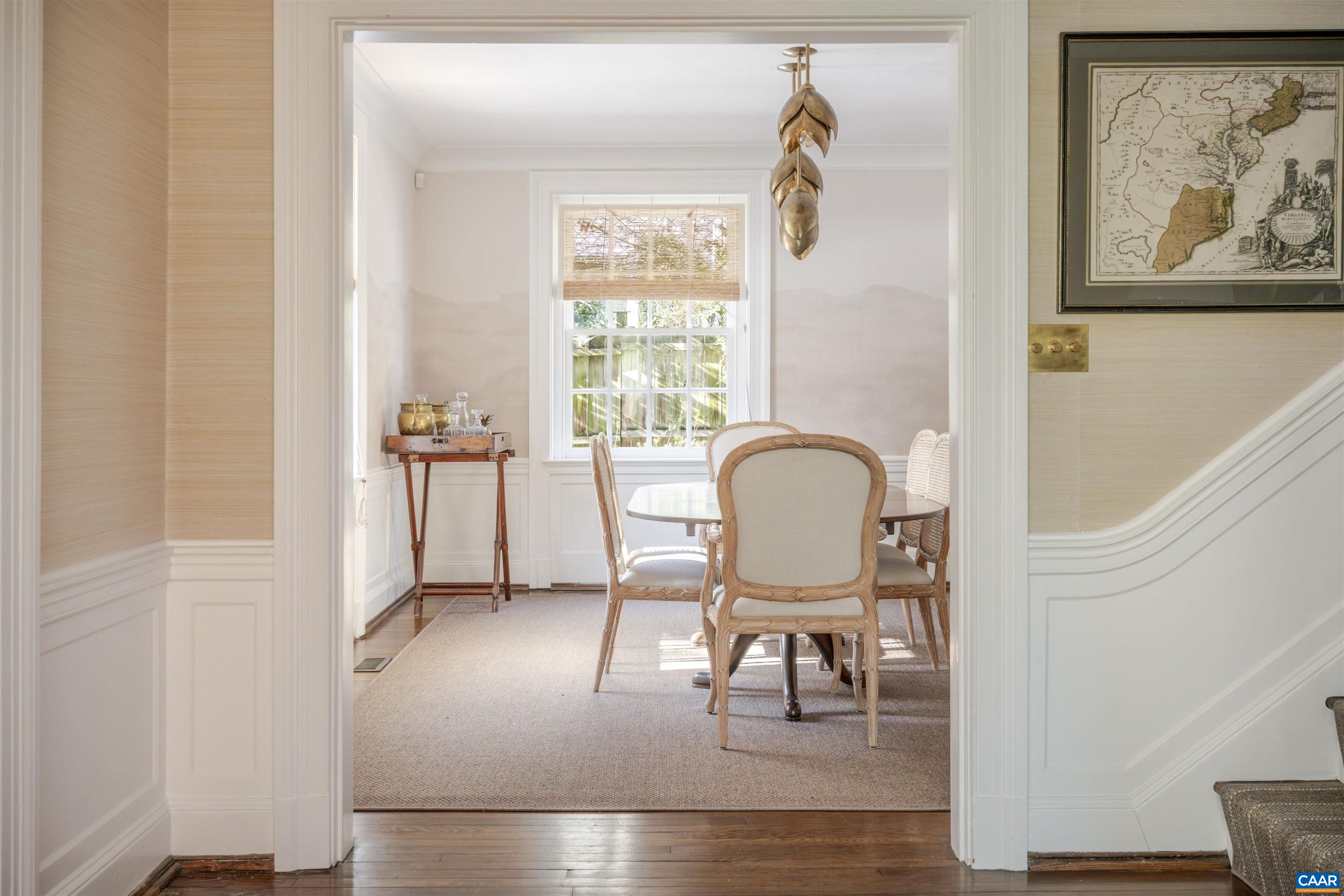 921 Rugby Road Charlottesville, VA 22903 - Photo 7 of 41 a view of a dining room with furniture window and wooden floor