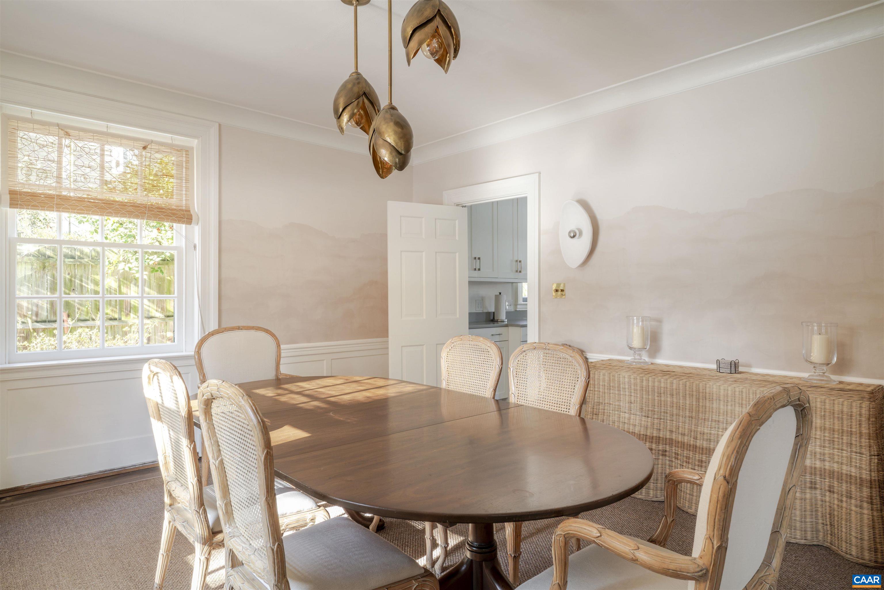 921 Rugby Road Charlottesville, VA 22903 - Photo 9 of 41 a view of a dining room with furniture and window