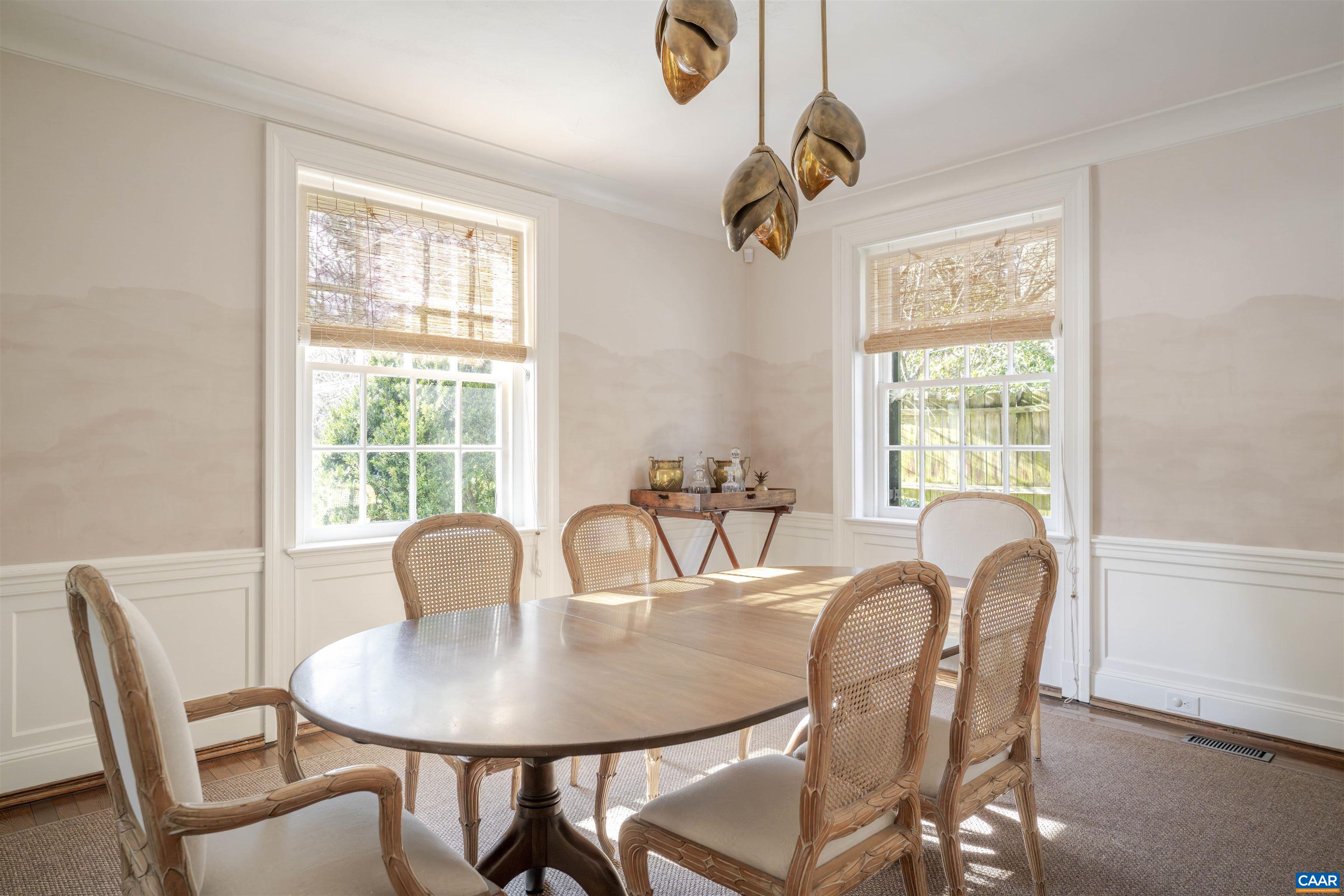 921 Rugby Road Charlottesville, VA 22903 - Photo 10 of 41 a view of a dining room with furniture window and outside view