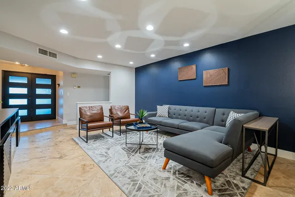 a view of a livingroom with furniture and a window