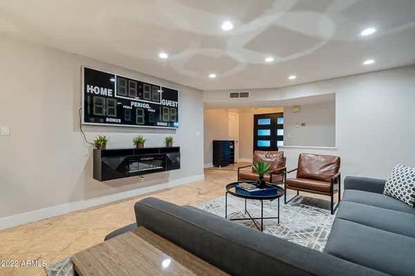 a view of a livingroom with furniture and a chandelier