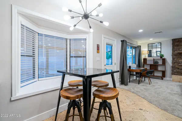 a kitchen with stainless steel appliances a stove a microwave and a refrigerator